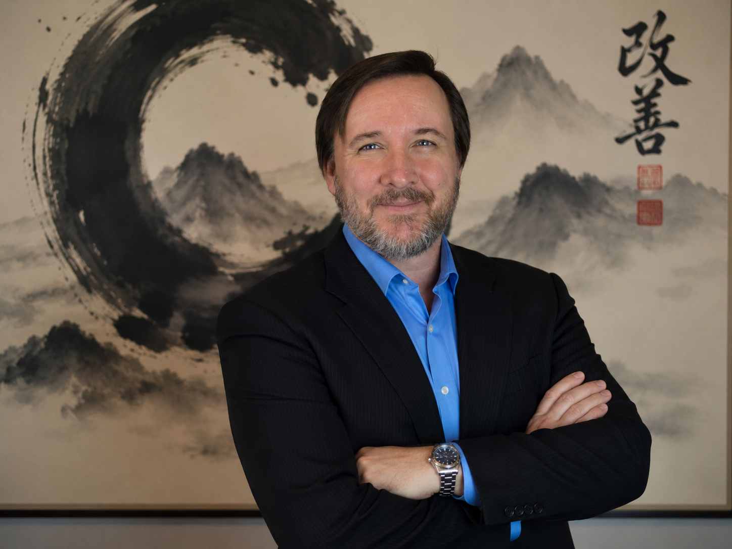 Jeremy J. Turner in professional pose with kaizen calligraphy backdrop